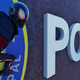 Miles perched on the facade of a police precinct.